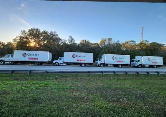 Cevi Med fleet of branded delivery trucks